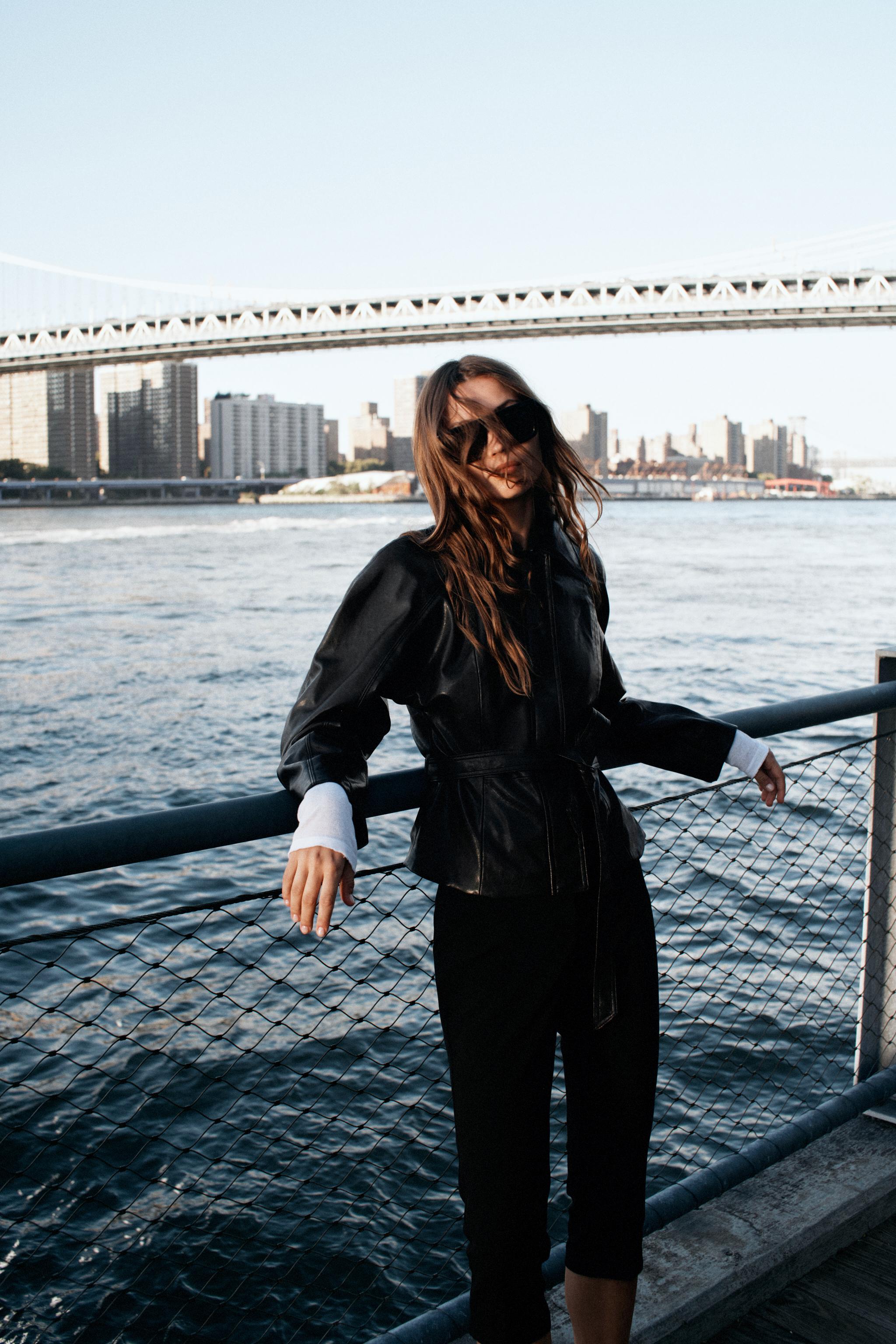 LEATHER-EFFECT BELTED JACKET